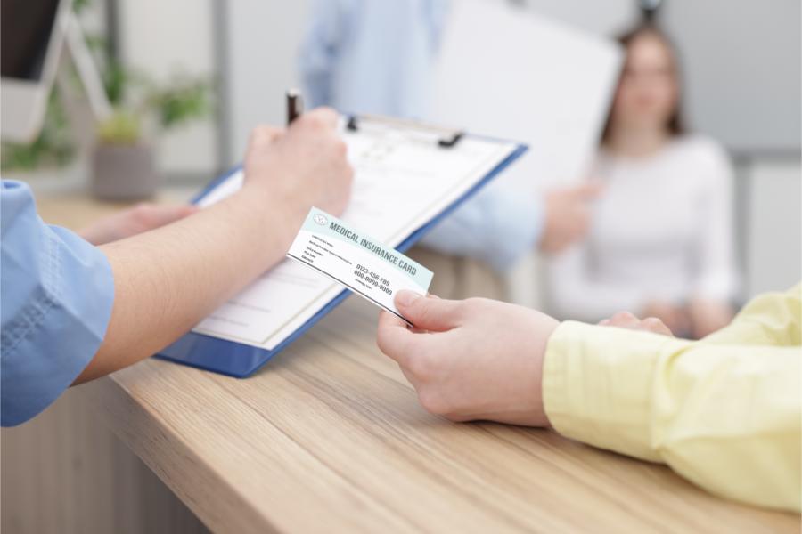 patient paying with medical insurance card